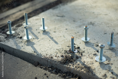 Construction of foundation. Steel bolt in concrete. Fasteners for frame.