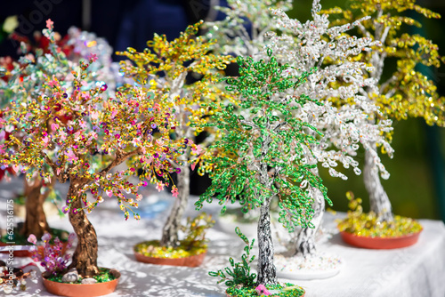 Fotografie Handcrafted beaded trees for sale at the handicraft fair.