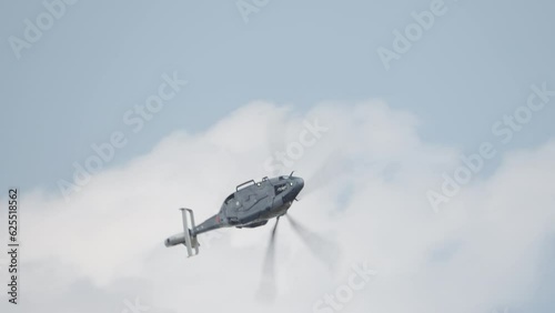 H160 Helicopter during low altitude flight photo