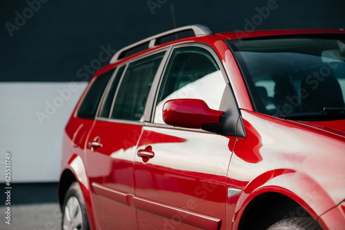 Stylish and bright family universal car of red color.