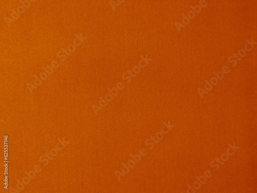 Orange velvet fabric texture used as background. orange fabric background of soft and smooth textile material. There is space for text..
