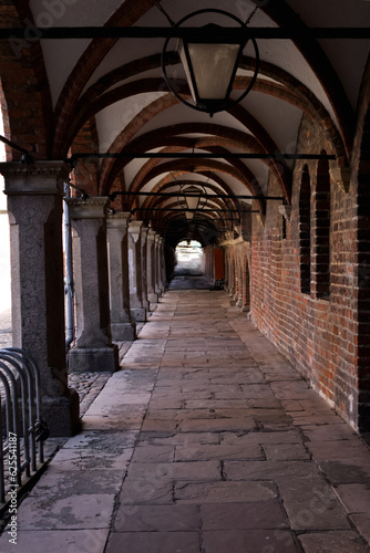 Medieval empty corridor with arches in the old town