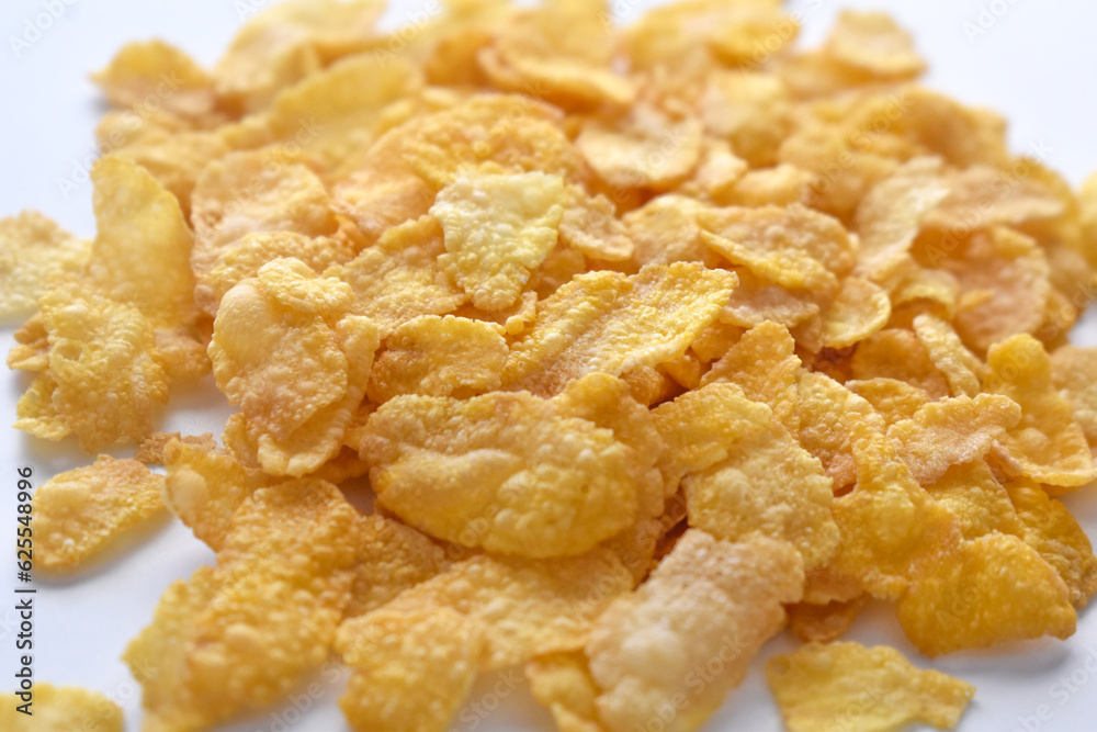 Crunchy cornflakes cereal on the table. Healthy breakfast concept. Crunchy cornflakes cereal on the table. Healthy breakfast concept.