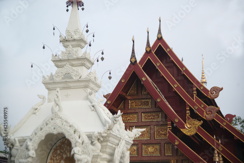 The entrance gate of Phra Chedi Chai Mongkhon Si Dvaravati with beautiful stucco and wooden carvings at Wat Pa Pathomchai. Located at Nakhon Pathom Province in Thailand.