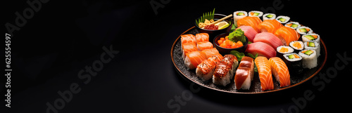 A round sushi box with various delicious fresh sushi in a black bowl on a black Background with negative space. Take away food isolated on white.