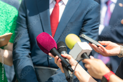 Experience a thought-provoking conversation as journalists engage in an interview with a businessman at a press conference, providing valuable insights and capturing the essence of the event."
