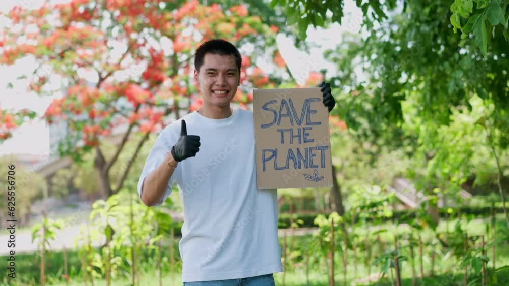Happy young Asian students diverse volunteers hold a campaign sign for Save the Planet, The concept of environmental conservation on world environment day, recycling, and charity for sustainability. Happy young Asian students diverse volunteers hold a campaign sign for Save the Planet, The concept of environmental conservation on world environment day, recycling, and charity for sustainability.