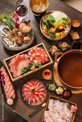 Seafood cuisine plate and beef sliced meat for hot pots. pork slices, scallops, seashells, oysters, caviar and other seafood delicacies.