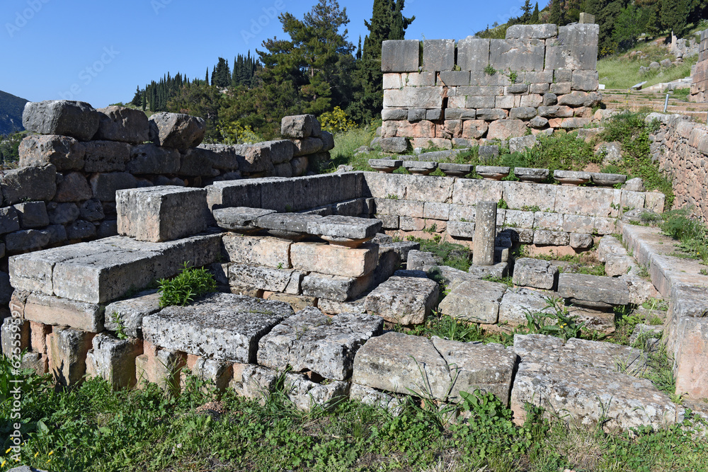 view to the ruins and the sacred way leading to the treasury of the Athenians in Archaeological Site of Delphi, Greece
