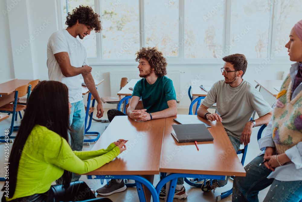 A diverse group of students gathers in a modern school classroom ...