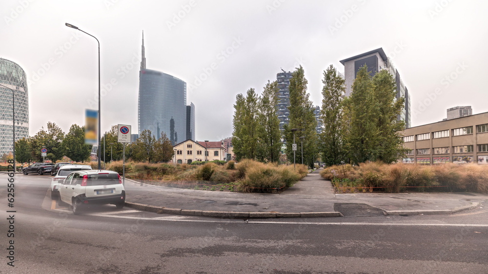 Panorama showing skyscrapers and towers from park with green lawn timelapse in Milan Panorama showing skyscrapers and towers from park with green lawn timelapse in Milan