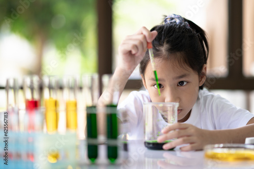 A girl doing a science experiment.