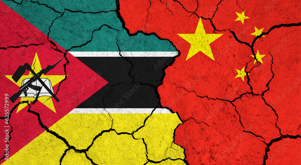 Flags of Mozambique and China on cracked surface - politics, relationship concept