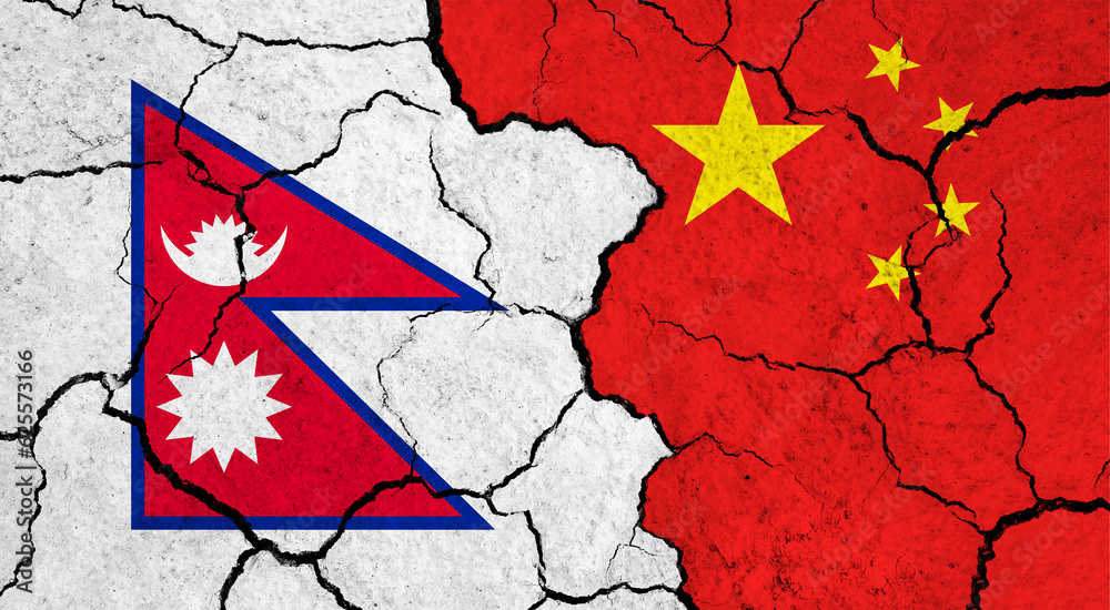 Flags of Nepal and China on cracked surface - politics, relationship concept