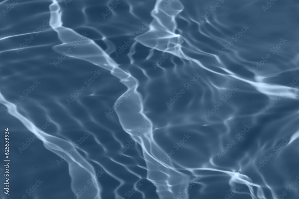 Blue water with ripples on the surface. Defocus blurred transparent blue colored clear calm water surface texture with splashes and bubbles. Water waves with shining pattern texture background. Blue water with ripples on the surface. Defocus blurred transparent blue colored clear calm water surface texture with splashes and bubbles. Water waves with shining pattern texture background.