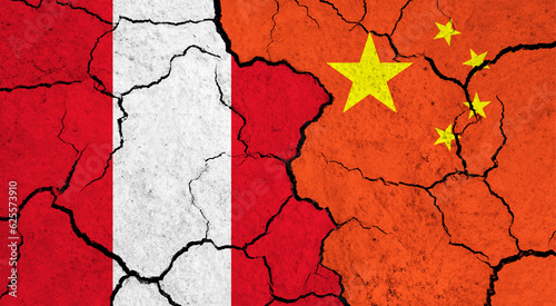 Flags of Peru and China on cracked surface - politics, relationship concept