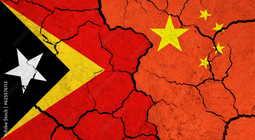 Flags of East Timor and China on cracked surface - politics, relationship concept Flags of East Timor and China on cracked surface - politics, relationship concept