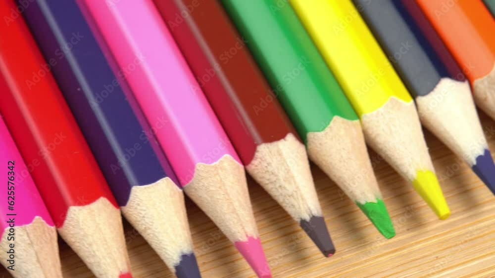 Colorful pencils rotate as a background. Rainbow pencils for drawing. Assortment of colored pencils. Back to school concept Colorful pencils rotate as a background. Rainbow pencils for drawing. Assortment of colored pencils. Back to school concept