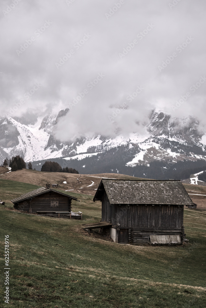  touristic houses. misty fog wooden travel cabin on the hills. Alpe di siusi, Seiser alm Italian.