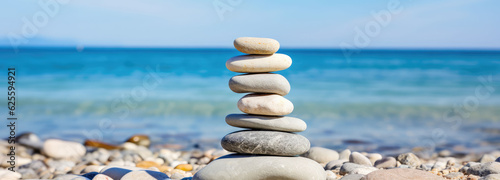 Some stones are stacked on a beautiful seaside sandy beach