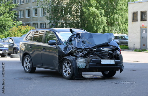 A new black wrecked car after an accident, Iskrovsky Prospekt, Saint Petersburg, Russia, July 20, 2023