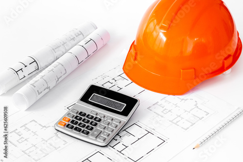 Builders or designers desk top with drawing blueprints for architectural project