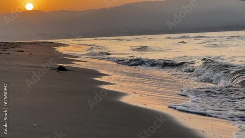 Wallpaper Mural Waves crashing on the shore at a beach sunset. Torontodigital.ca