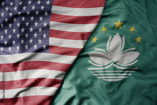 Fototapeta Naklejka Na Ścianę i Meble -  big waving colorful flag of united states of america and national flag of Macau .