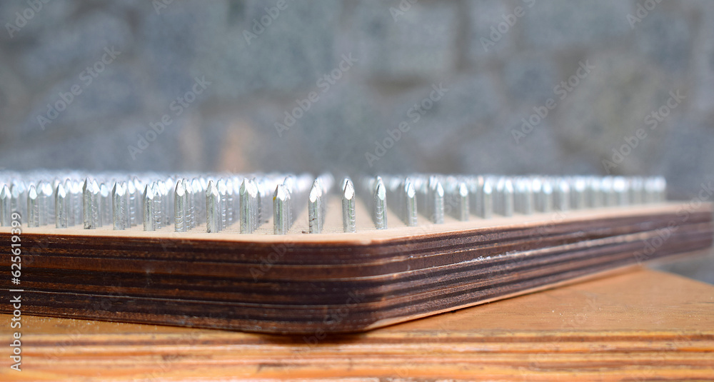 Part of a board with nails for a yoga class close-up. Part of a board with nails for a yoga class close-up.