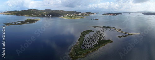 panoramic view of the Ria De Arosa with the Isla de la Toja in the background.