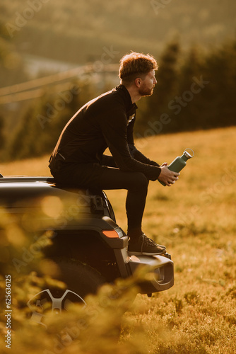 Young man relaxing on a ter...