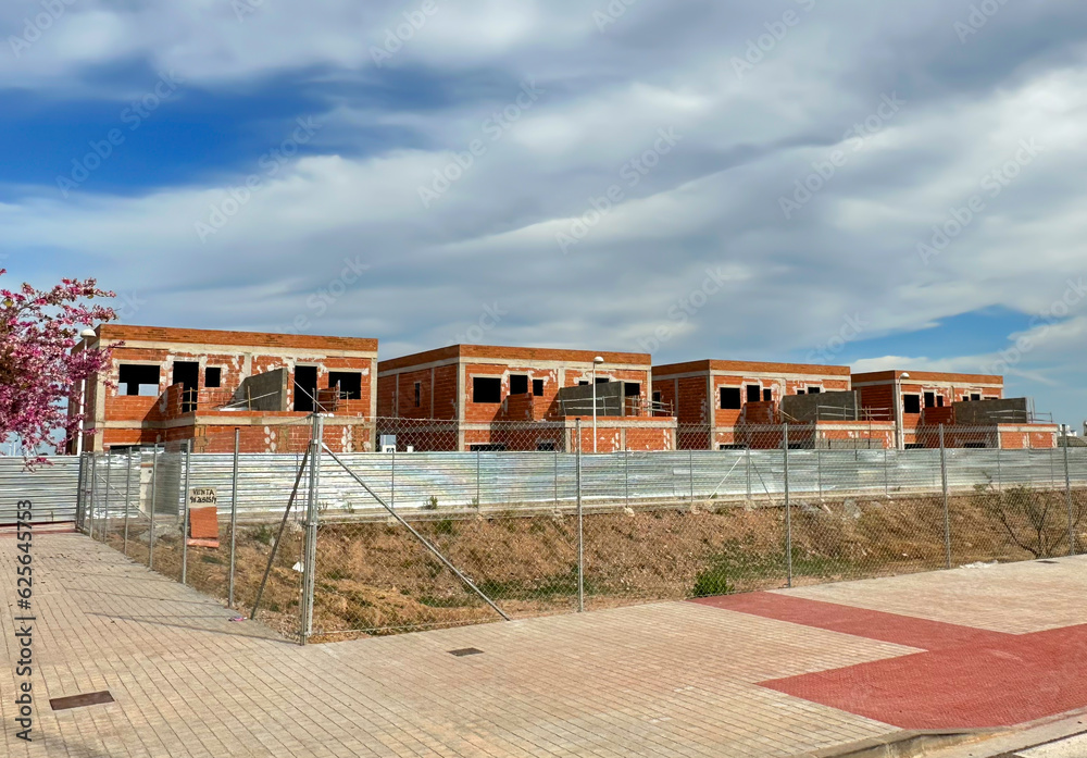 Townhouse on Construction site. Construction of modern house near coastline. Home renovation. Villa under construction. Luxury villa under construction near beach of Mediterranean sea.