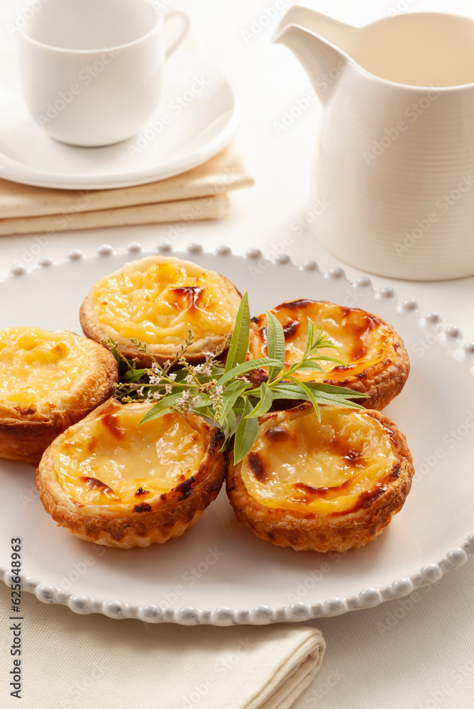 Pastel de Belem, traditional Portuguese dessert made with egg and cream Pastel de Belem, traditional Portuguese dessert made with egg and cream