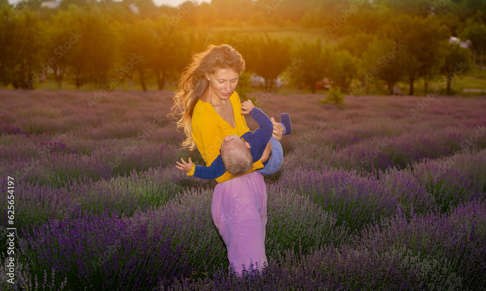 Fototapeta premium Mother and her baby in the lavender field .