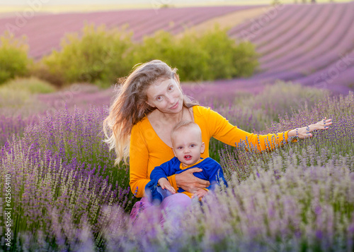 Fototapeta Naklejka Na Ścianę i Meble -  Mother and her baby in the lavender field .