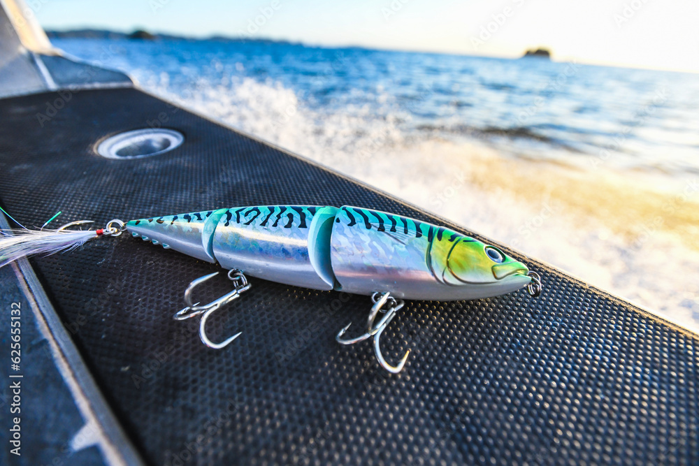 fishing lure on boat at sunrise
