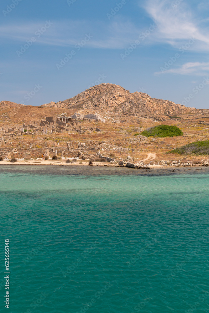 Delos island - view of this famous archaeological site from the water Delos island - view of this famous archaeological site from the water