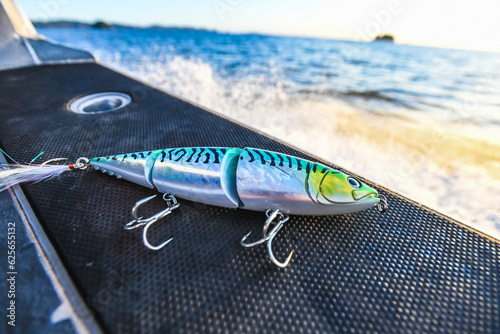 Obraz na płótnie fishing lure on boat at sunrise w salonie