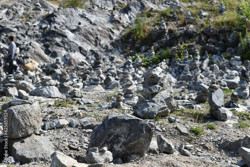 Handmade stone figures in a nature reserve. people lay out turrets from natural stones in the park