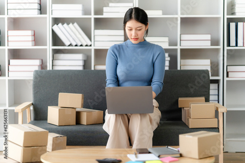 Portrait of Starting small businesses SME owners female entrepreneurs working on receipt box and check online orders to prepare to pack the boxes, sell to customers, SME business ideas online.