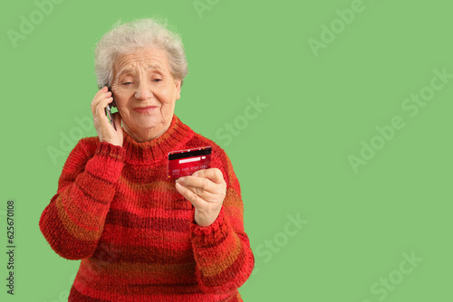 Senior woman with credit ca...