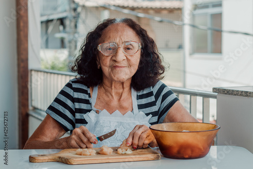 Portrait Elderly Brazilian woman getting ready to cook