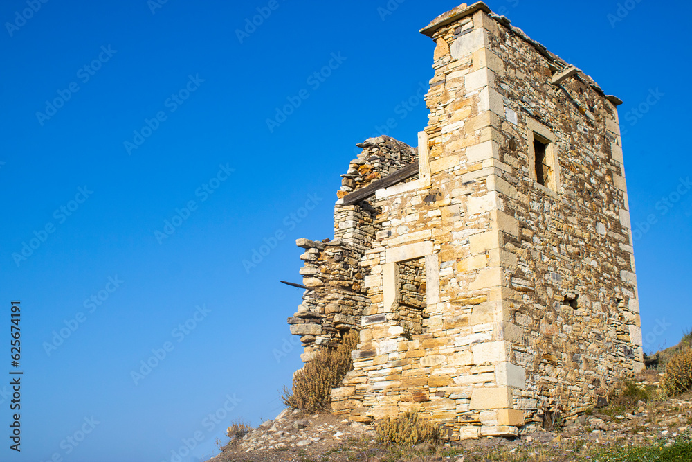 A destroyed stone house.