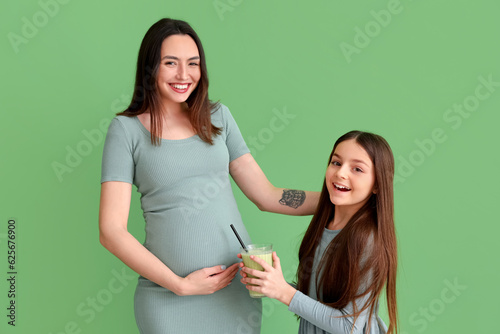 Happy pregnant mother and d...