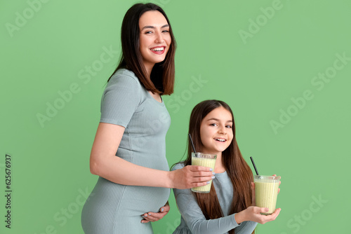 Happy pregnant mother and d...