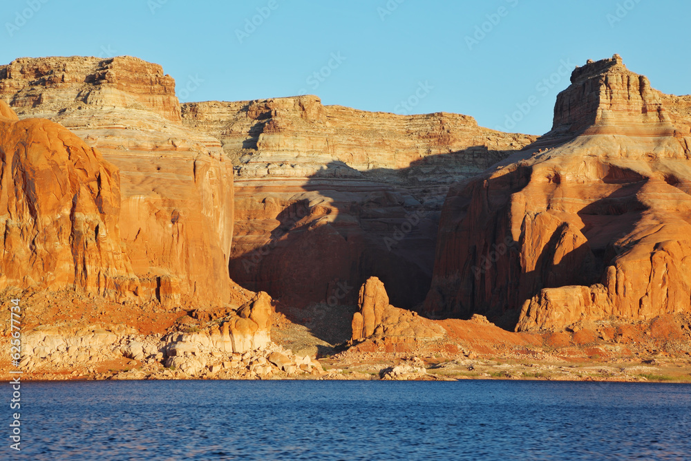 The red  cliffs on the shores of Lake Powell. Arizona, United States, sunset