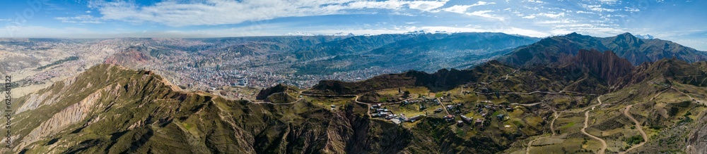 Aerial view from the impressive landmark Muela del Diablo down into the valley with the highest capital and vibrant city La Paz and El Alto, Bolivia - Panorama