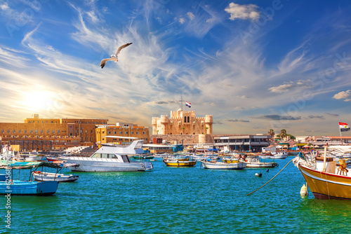 Harbour and boats in Alexandria near Qaitbay Citadel, famous view of Egypt
