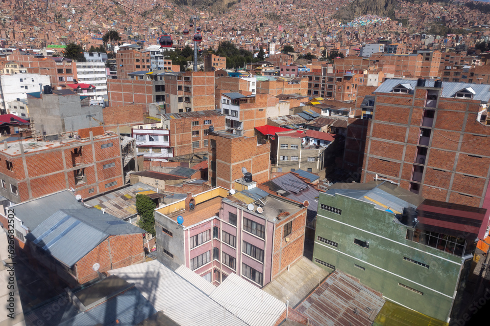 La Paz, the highest administrative capital and vibrant city in Bolivia viewed from the red cable car / teleferico from the center to El Alto market
