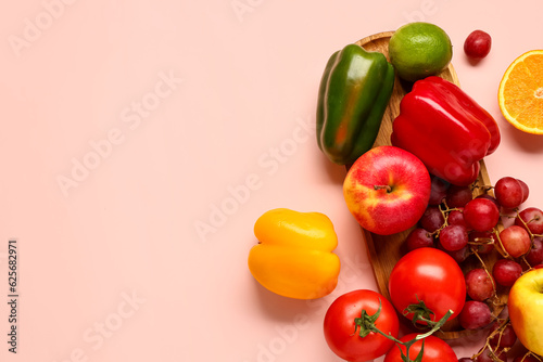 Fruits and vegetables on beige background. Healthy food concept